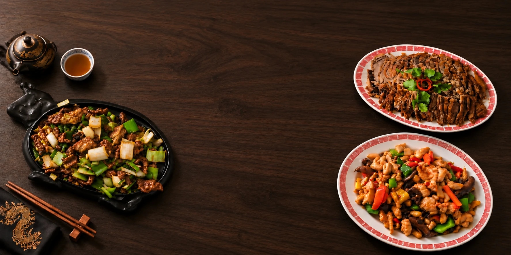 A laid table with Mongolian meat, crispy duck and the eight treasures dish